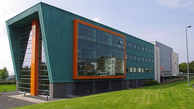 a modern green and orange building housing computer sciences department