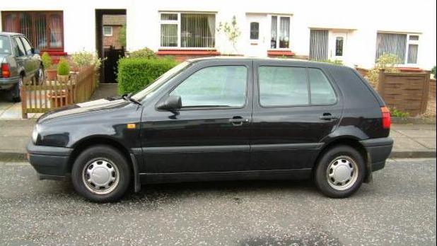 A Volkswagen VW Golf parked in a street