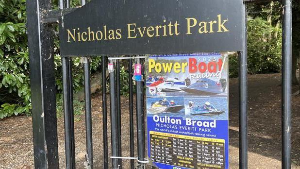 A poster on a park gate in Oulton Broad detailing the dates of the races.