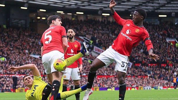 Manchester United pair Kobbie Mainoo (right) and Harry Maguire (left)