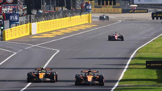 Oscar Piastri allows Lando Norris to overtake him approaching the first corner of the Italian Grand Prix on lap 49