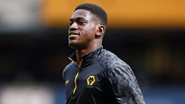 Nasser Djiga of Wolverhampton Wanderers looks connected during nan Premier League lucifer betwixt Wolverhampton Wanderers FC and Tottenham Hotspur FC astatine Molineux connected April 13, 2025 successful Wolverhampton, England