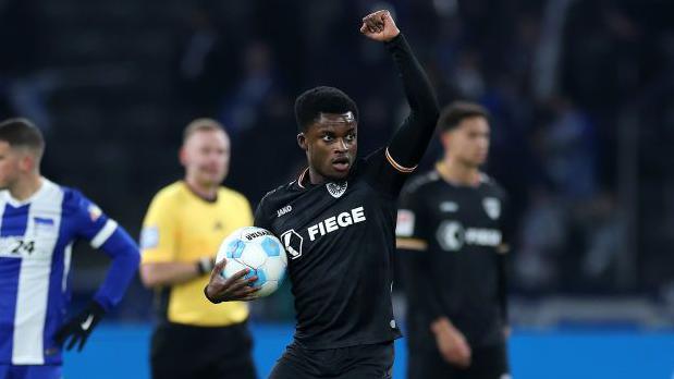 Daniel Kyerewaa of SC Preussen Munster celebrates after scoring his side's first goal during the Second Bundesliga match between Hertha BSC and SC Preussen Munster