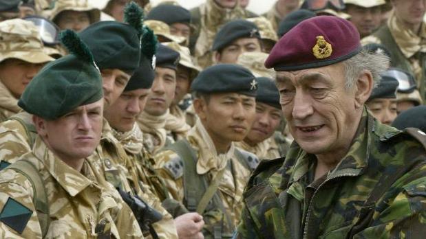 General Sir Mike Jackson (R), Britain's armed forces chief, visits Camp Eagle 4 with some of the British Army Gurkhas of the 1st Battalion, The Royal Irish Regiment (Canterbury) in the northern Kuwaiti desert 07 March 2003.