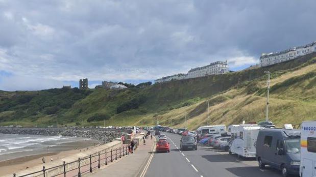 Cars and motorhomes parked along Scarborough sea front