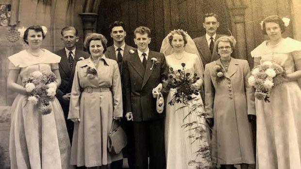 A black and white picture of the wedding party in 1952