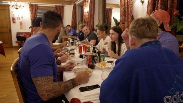 Bobsleigh and skeleton athletes eating dinner