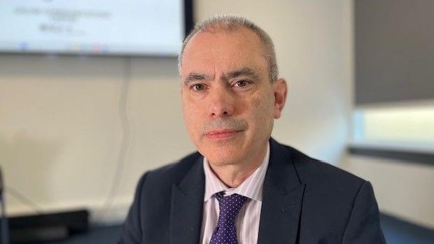 Paul Brisley sitting in an office at the National Crime Agency headquarters in London