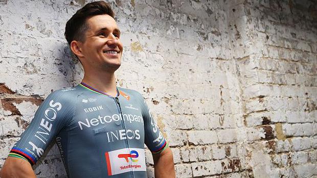 Michal Kwiatkowski models the new Netcompany-Ineos Cycling Team jersey