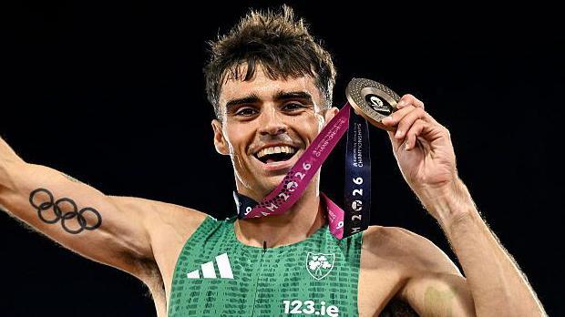 Andrew Coscoran with his bronze medal