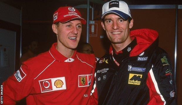 Mark Webber (right) with Michael Schumacher