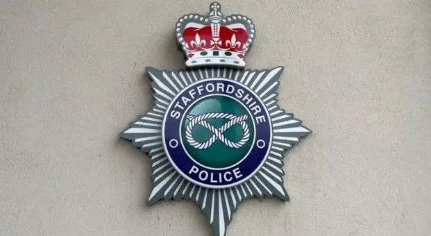 A Staffordshire Police emblem on a pale-coloured wall