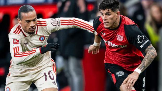 Piero Hincapie is tackled by Leroy Sane