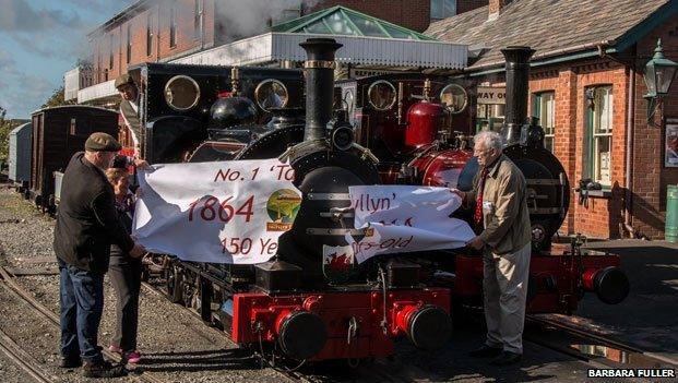 The engine broke through a 150th birthday banner on Wednesday