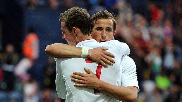Harry Kane (facing camera) and Will Keane