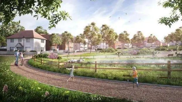 A CGI image of a new housing development. There are houses at the back of the image with children running on a path in the foreground around a fenced-off lake