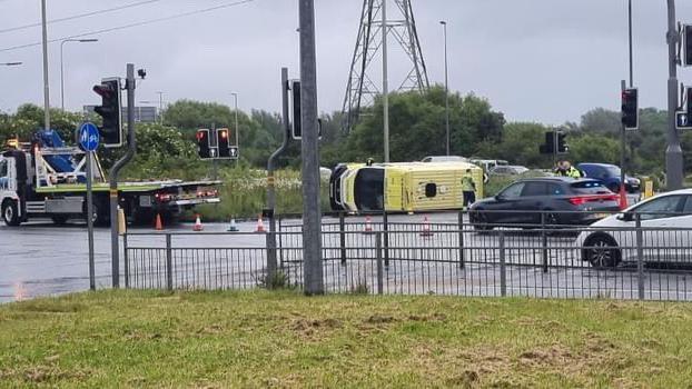 Overturned ambulance at Switch Island showing the rest of the traffic