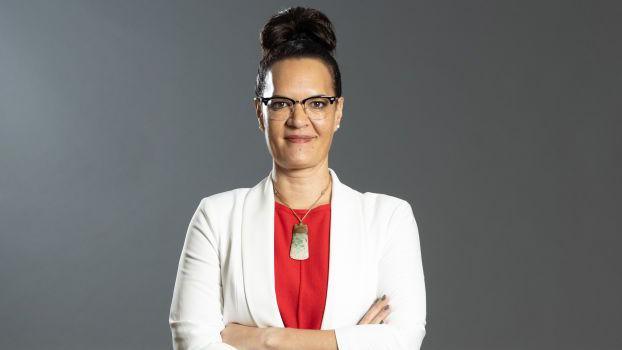 Tonga coach Jaqua Pori-Makea-Simpson in white smart jacket and red blouse