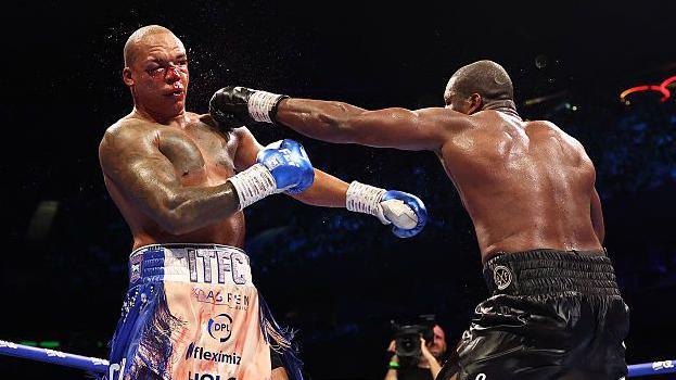 Daniel Dubois (right) lands a punch on Fabio Wardley (left)