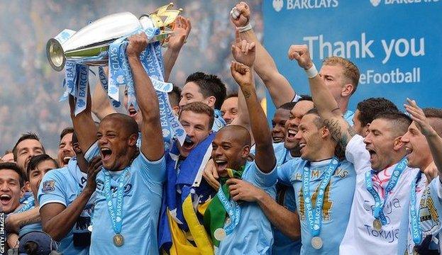 Manchester City lifting the Premier League trophy