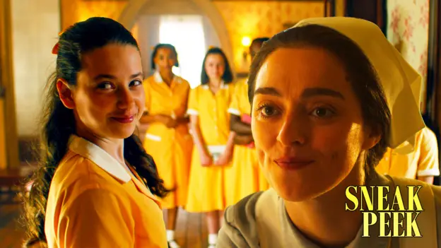A group of school girls in yellow uniforms smirk, the matron is added to the picture and she doesn't look impressed.