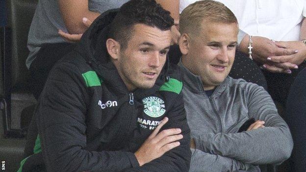 John McGinn watches Hibs' first-leg win from the stands