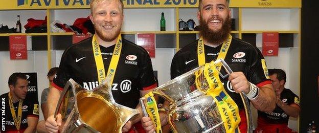 Jackson Wray of Saracens and Will Fraser of Saracens celebrate their 'double' success with the European Cup and Premiership trophies