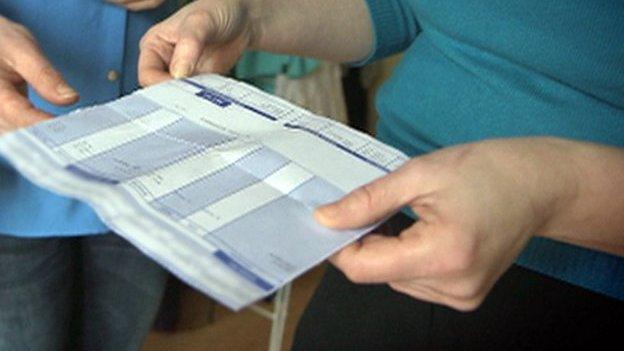 Worker looking at payslip