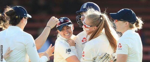 Laura Marsh (centre) celebrates a wicket with Sophie Ecclestone (second right, in sunglasses)