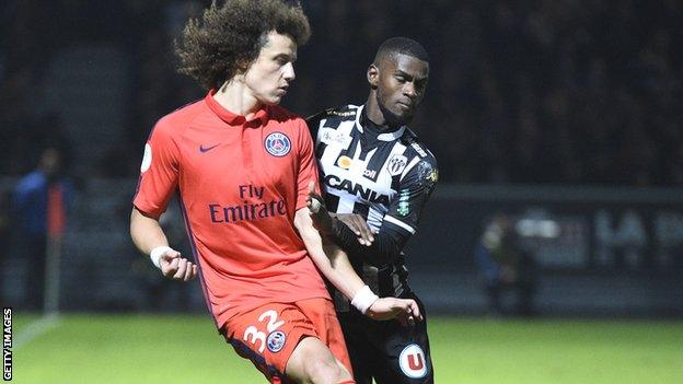 Abdoul Camara (right) in action for Angers against PSG defender David Luiz