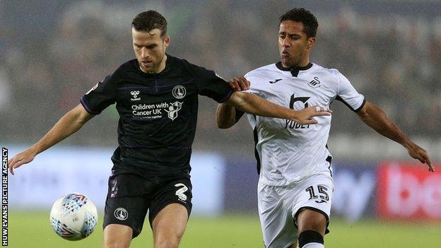 Charlton Athletic's Adam Matthews holds off Swansea's Wayne Routledge