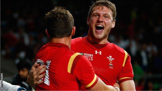 Dan Biggar celebrates with Lloyd Williams