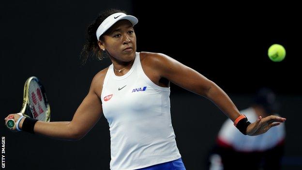 Naomi Osaka plays a forehand in semi-final victory over Caroline Wozniacki in the China Open