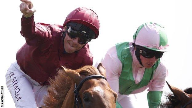 Frankie Dettori, left, celebrates on Wings Of Desire at York