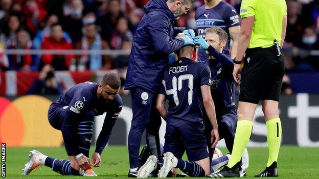 Phil Foden has his head bandaged