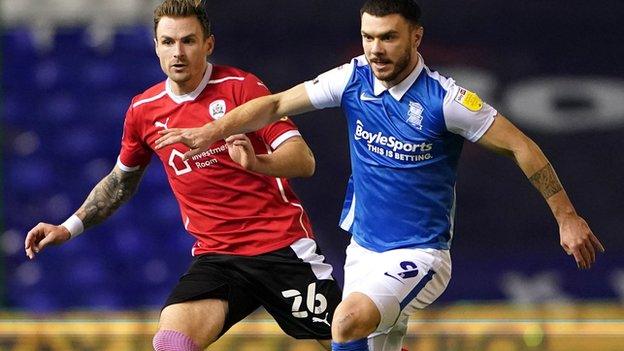 Birmingham City's Scott Hogan and Barnsley's Michael Sollbauer