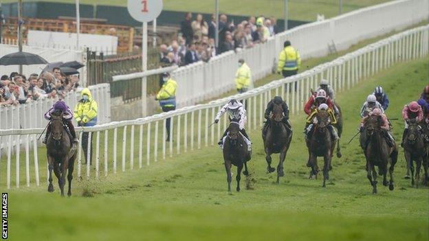 Frankie Dettori rides Snowfall to victory in The Oaks, at Epsom