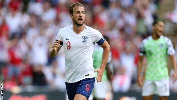 Harry Kane celebrates scoring the second