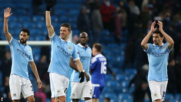 Manchester City players celebrate progress