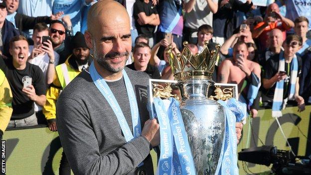Pep Guardiola lifts the Premier League title
