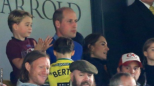 Prince William, Catherine and Prince George watch on at Carrow Road