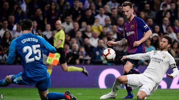 Ivan Rakitic scores for Barcelona against Real Madrid