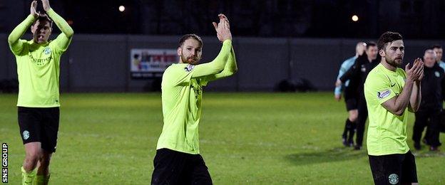 Hibs players applaud visiting fans at full-time