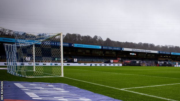 Adams Park attracted a crowd of 8,005 on a day when Wycombe's 2-0 home win over Oxford took them top of League One