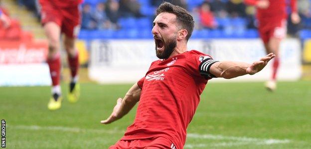 Shinnie celebrates his second, which secured the points for Aberdeen