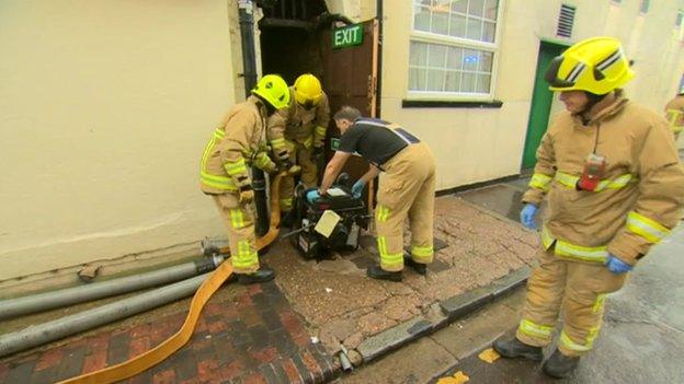 Firefighters pumping out water