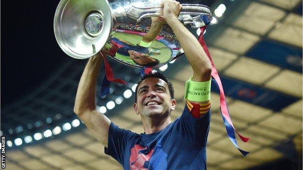 Xavi lifts the Champions League trophy