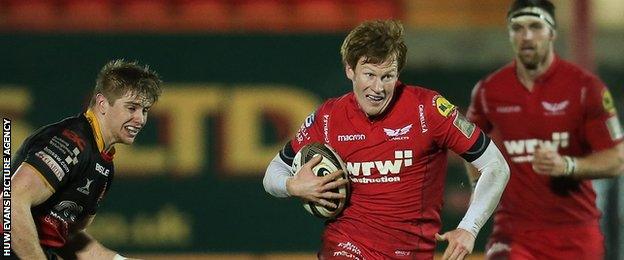 Rhys Patchell makes a break for Scarlets against Dragons in the Pro14