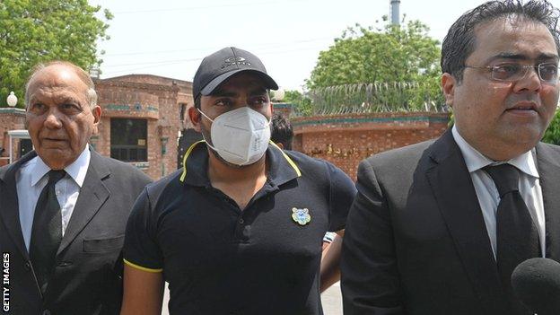 Pakistan batsman Umar Akmal with his lawyer