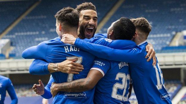 Rangers players celebrate Morelos goal